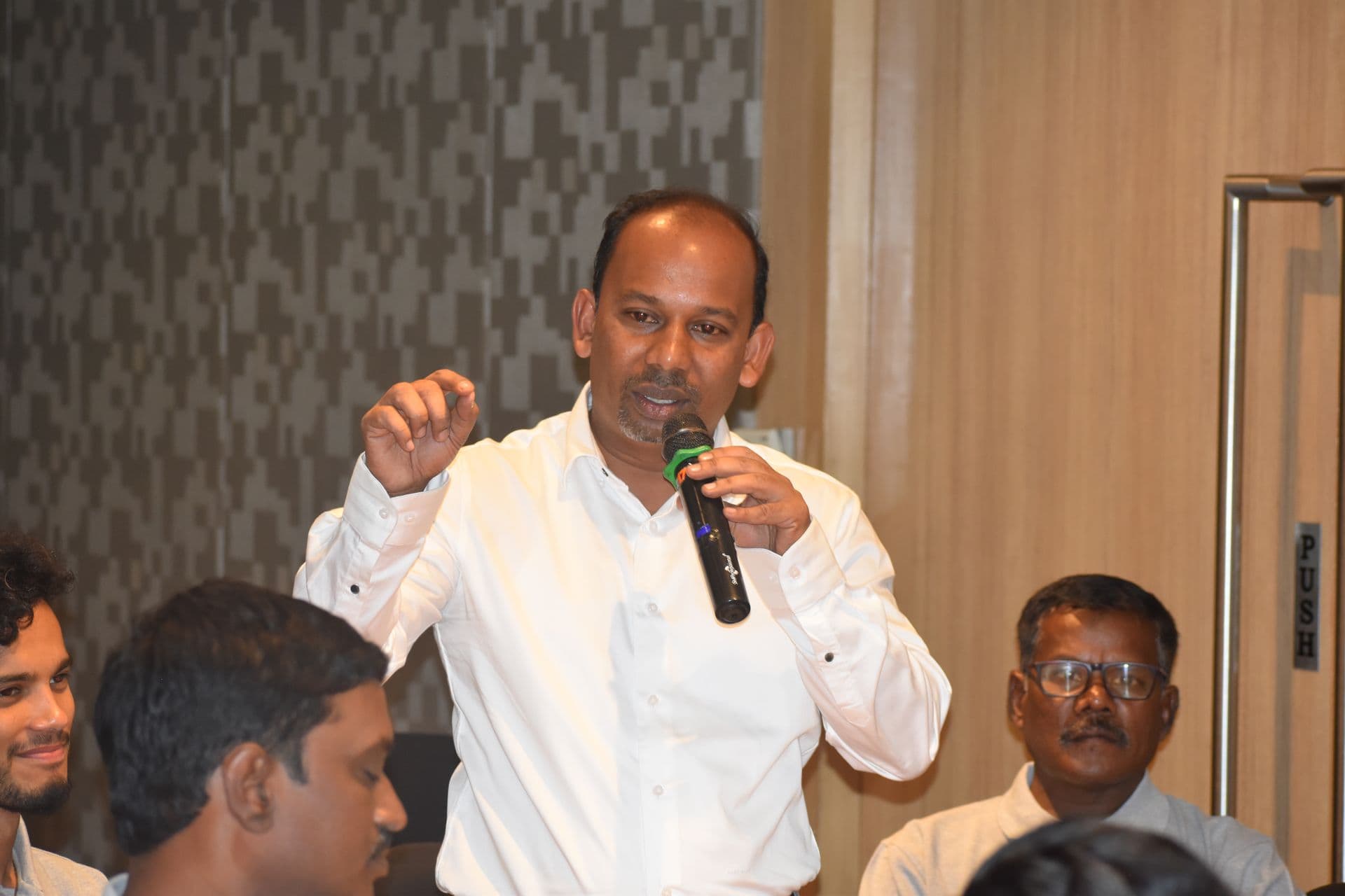 John Benedict speaking at a public event