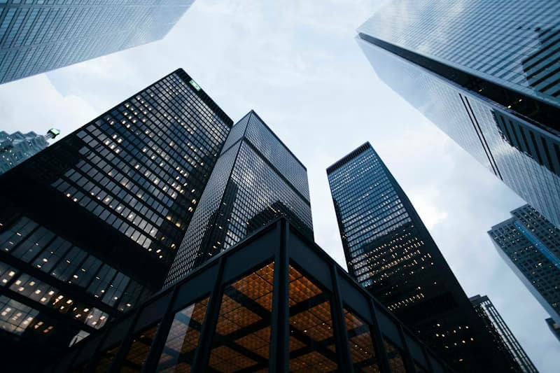 Modern glass commercial towers viewed from below