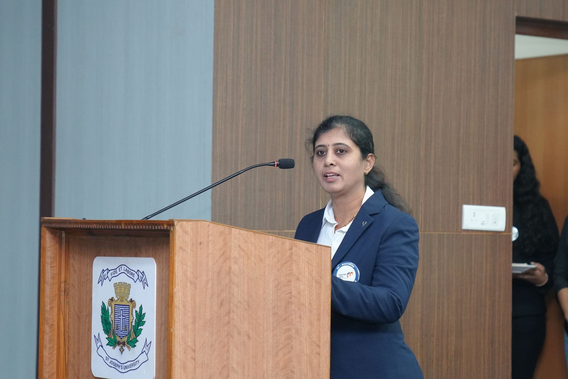 Shashikala Roogi speaking at a formal event